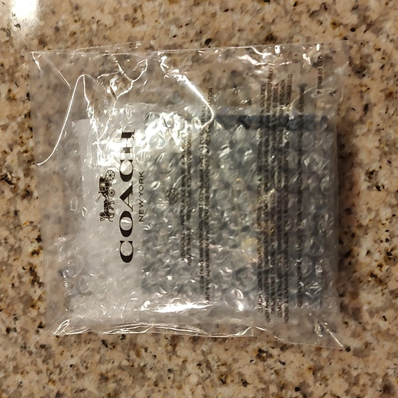 Nwt ladies Coach 2 toned safety pin necklace with charms - Picture 5 of 5